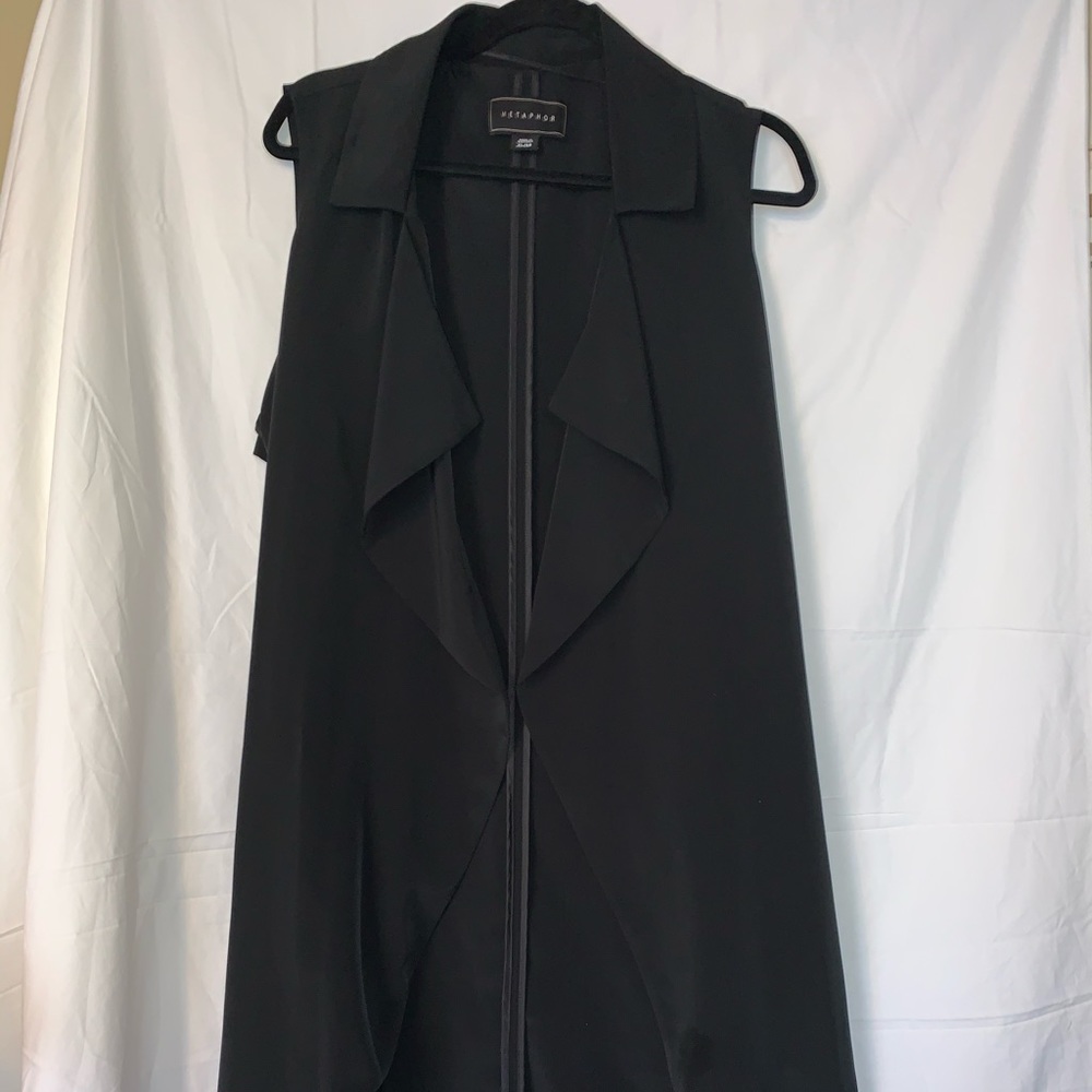 Long vest with belt.